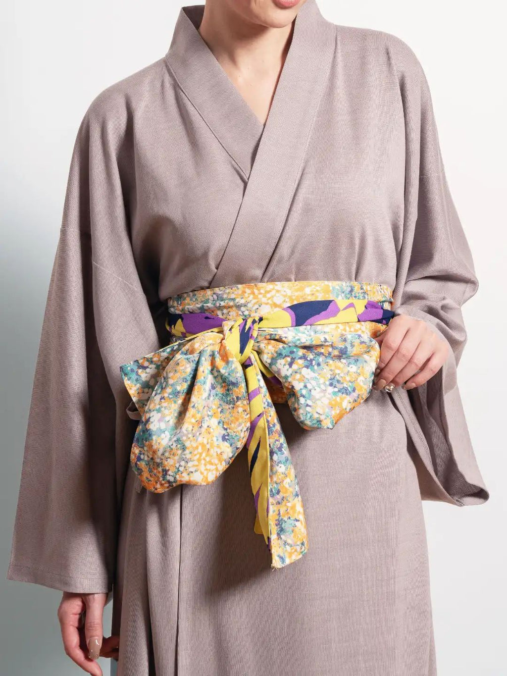 Freesia Obi-Belt handmade in Japan – floral yellow and violet obi displayed flat on soft background