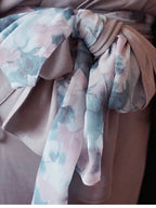 Close-up of decorative Kazari knot on green handcrafted Japanese Obi-Belt