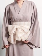 Close-up of Reversible White Obi-Belt front side showing soft satin texture handcrafted in Japan