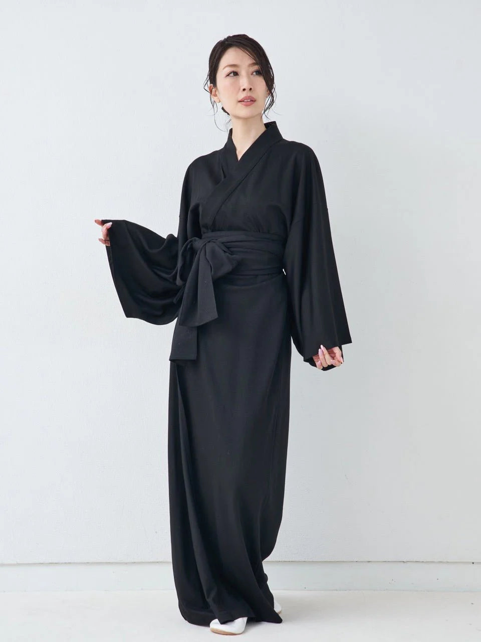 Premium Black Yukata displayed in serene Japanese interior – MikaStudio handcrafted loungewear